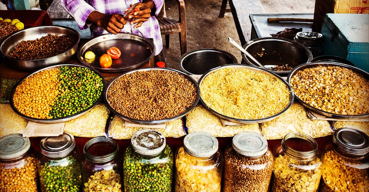 Skimming foam from stock without removing floating spices - Clear Glass Jars With Assorted Foods