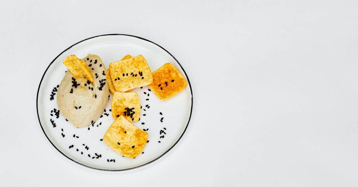 Slightly undercooked chickpeas - White and Brown Bread on White Ceramic Plate