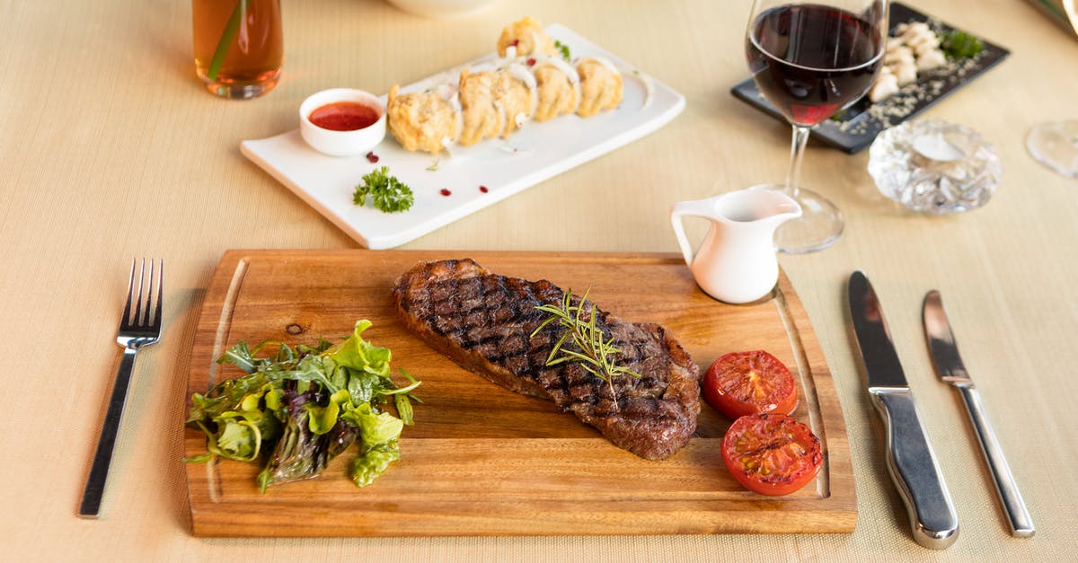 Slow cooked steak - Grilled Meat on Brown Wooden Chopping Board