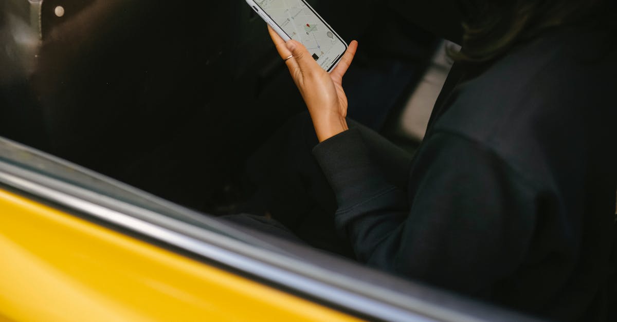 Smartphone app to guide me with cooking [closed] - Crop passenger with navigator app on smartphone in taxi vehicle