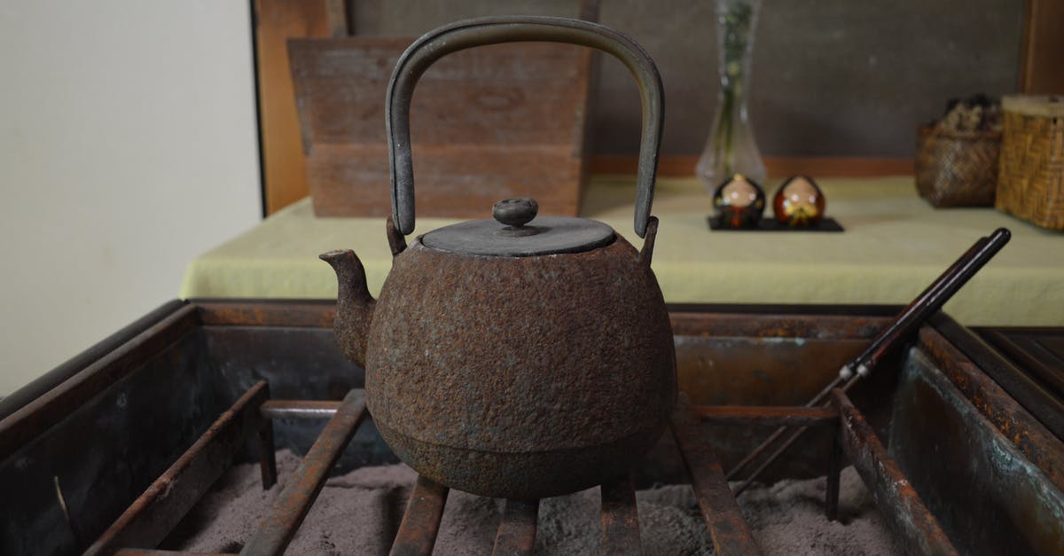 Smoking in Kettle Grill - Photo of a Rusty Kettle on the Grill