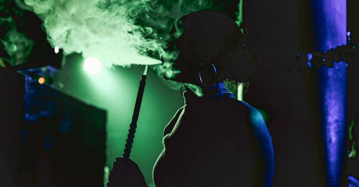 Smoking with chips after sous vide - Woman Smoking Shisha in Bar 