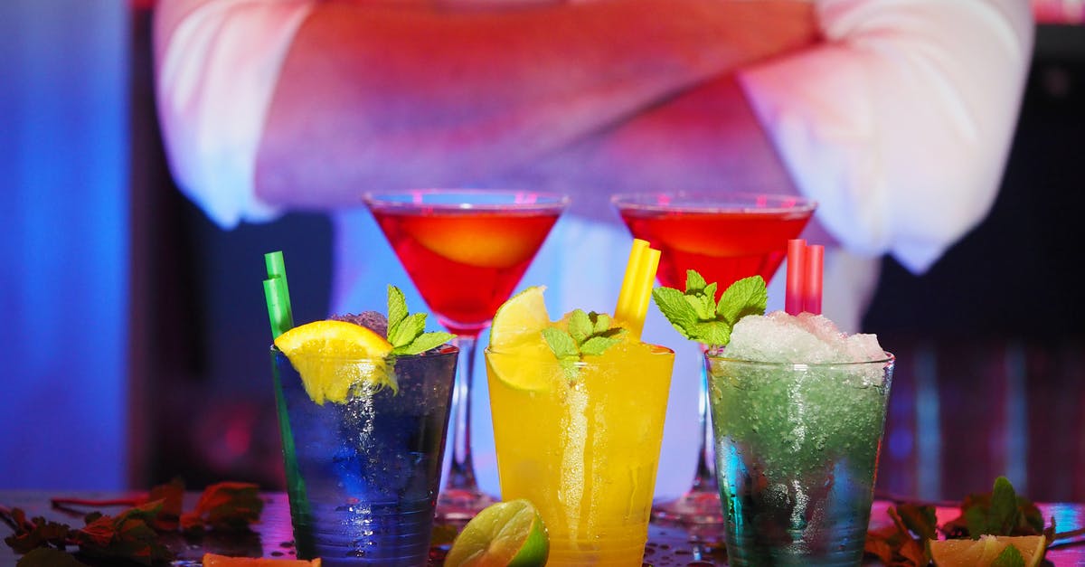 Soaking fruit in alcohol - Selective Blur of 2 Wine Glass and 3 Drinking Glass