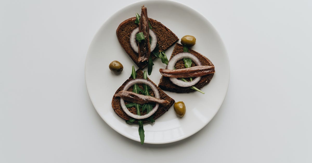 Soaking salted anchovies & umami - Brown and Green Vegetable on White Ceramic Plate