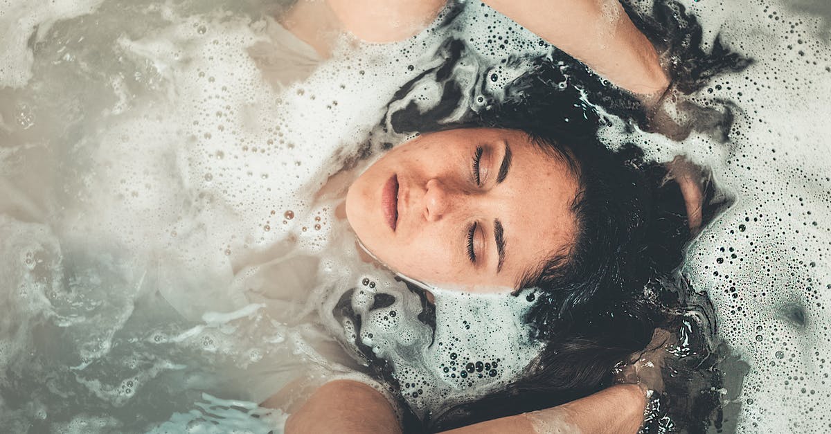 Soaking starches in water for better frying - Woman in Bath Tub