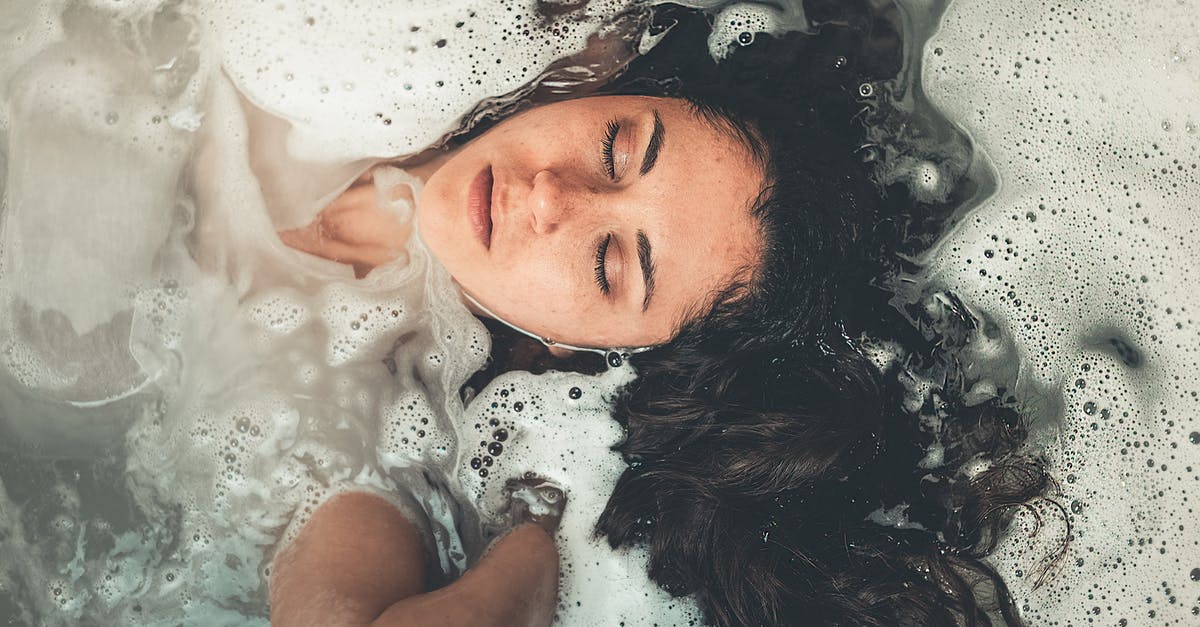 Soaking starches in water for better frying - Woman Soaked in Water With Bubbles