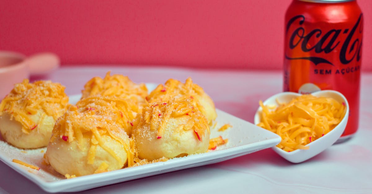 Soda carbonation - Food With Toppings on a White Tray and a Can of Soda