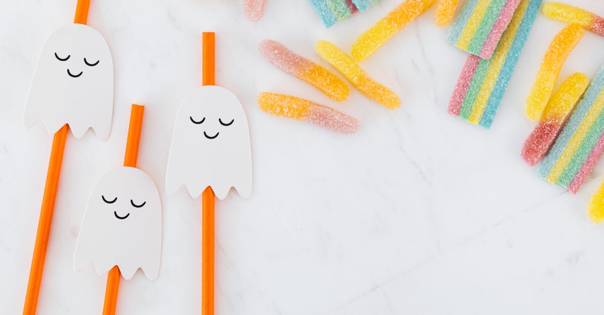 Softening nougat candy - Orange Straws with Ghost Decorations and Colorful Jelly Candy 