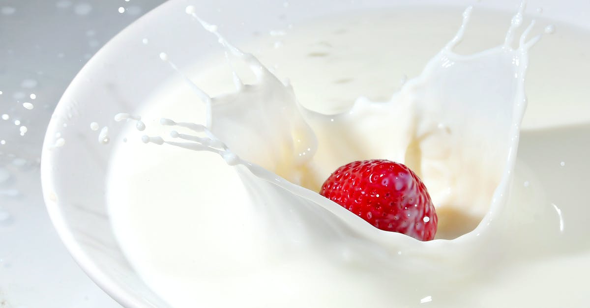 Soon-to-be cultured milk with fresh fruit safe for consumption? - Time Lapse Photography of Strawberry Falling on Milk