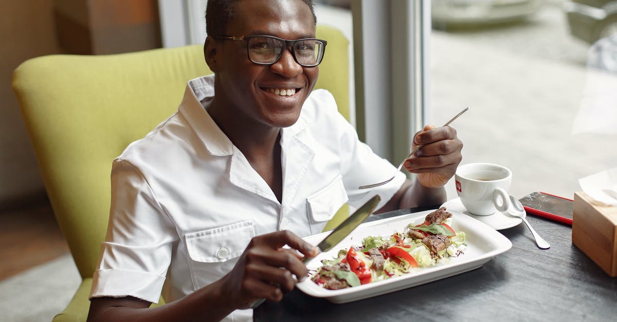 Sourdough Starter Black Spots - Cheerful man enjoying salad in cafe