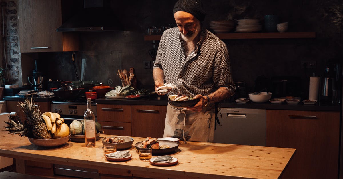 Sourdough starter developing alcohol - Muslim man with delicious food in house kitchen