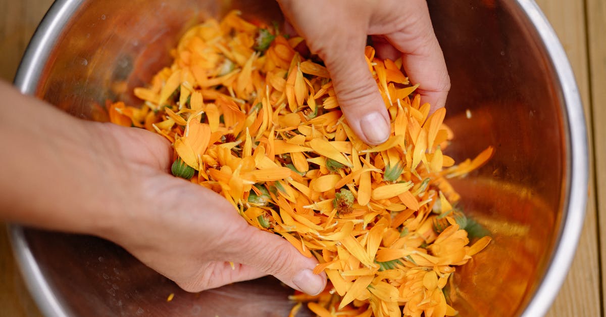 Speeding up soaking of cashews for a recipe - Person Holding Brown and Yellow Food