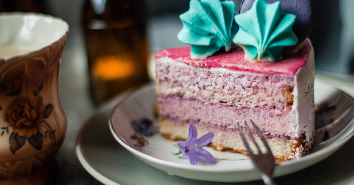 Spooning cake mix - Piece of pink cake with meringues and macaron