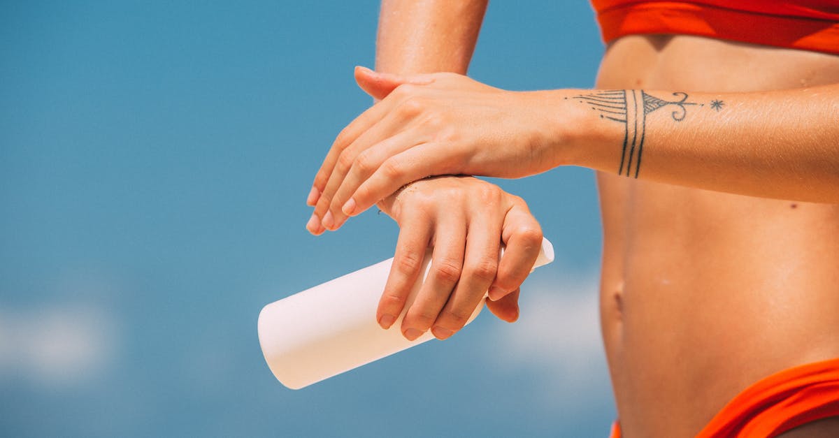 Spray bottle keeps spraying even when not squeezing trigger [closed] - Woman in Red Tank Top and Brown Leather Bracelet