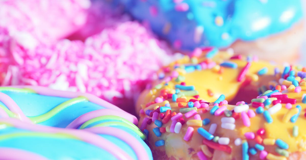 Sprinkles on rolled icing - Closeup Photo of Doughnuts