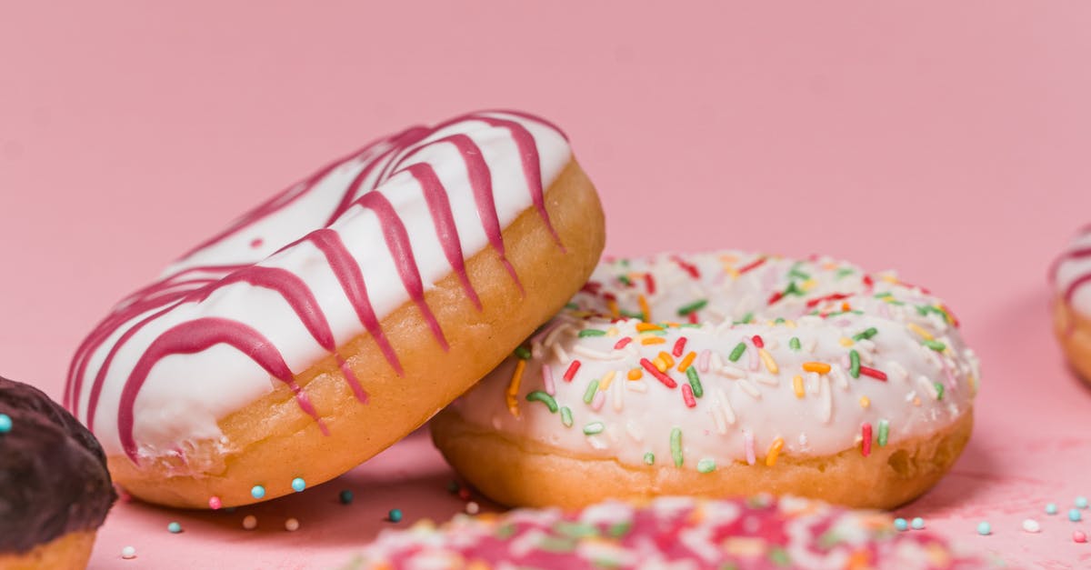 Sprinkles on rolled icing - Close-Up Photo of Colorful Doughnuts