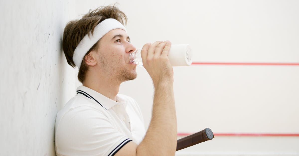 Squash Casserole: Reducing the water content? - Side View of a Squash Player Drinking Water