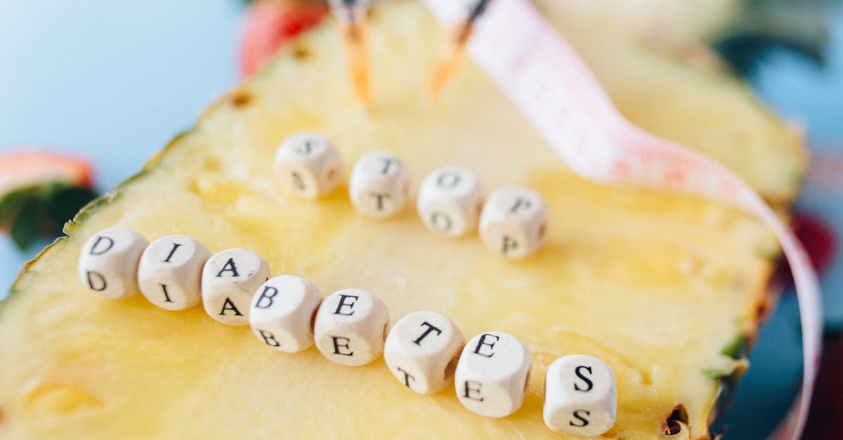 Standardized symbols for marking food allergies / warnings? - Letter Dices over a Cut Pineapple Fruit