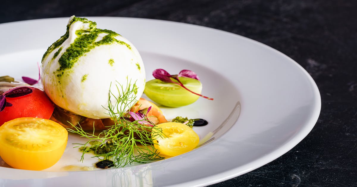 Starter with water, flour, grated apple - Sliced Fruit on White Ceramic Plate