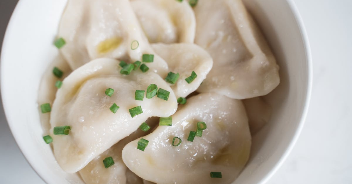 Steamed chicken soup [closed] - Steamed Dumplings with Onion Leeks in a Ceramic Bowl