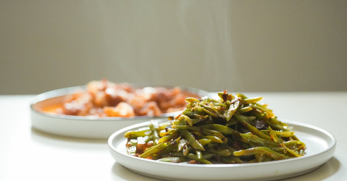 Steaming vegetables in microwave - Steaming Green Beans and Stew on White Plates