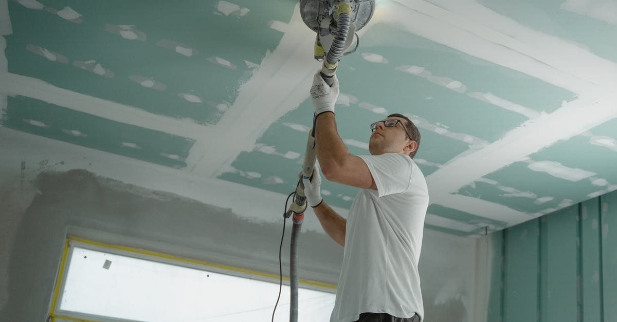 Steel Pan non-stick improvement by polishing - Man Polishing the Ceiling