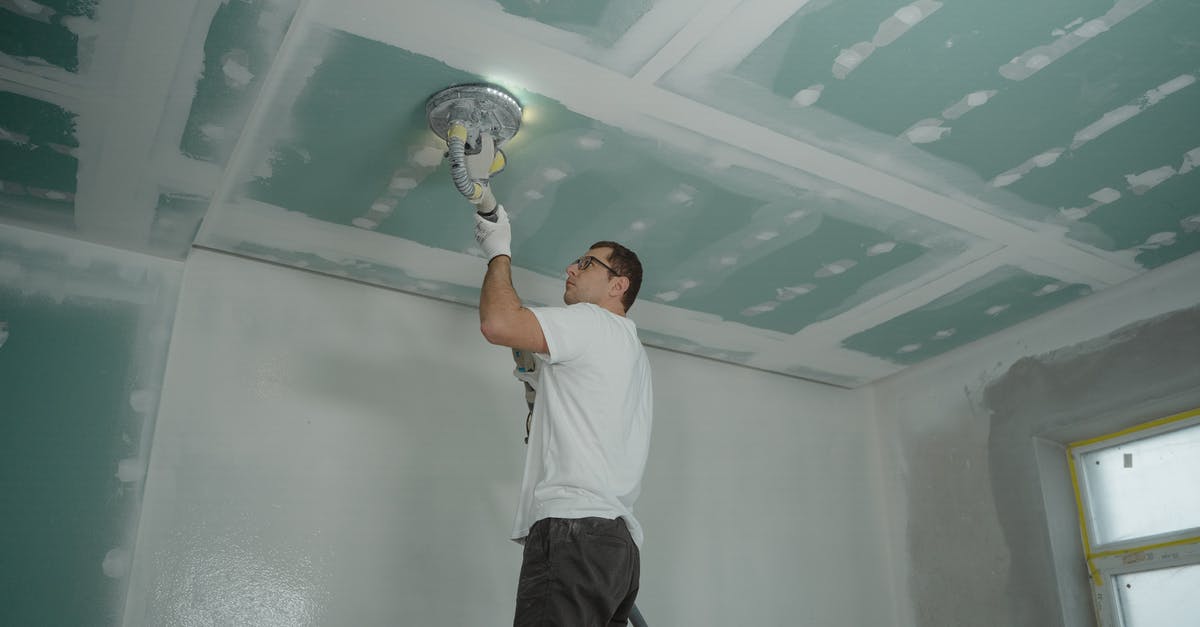 Steel Pan non-stick improvement by polishing - Man Polishing the Ceiling