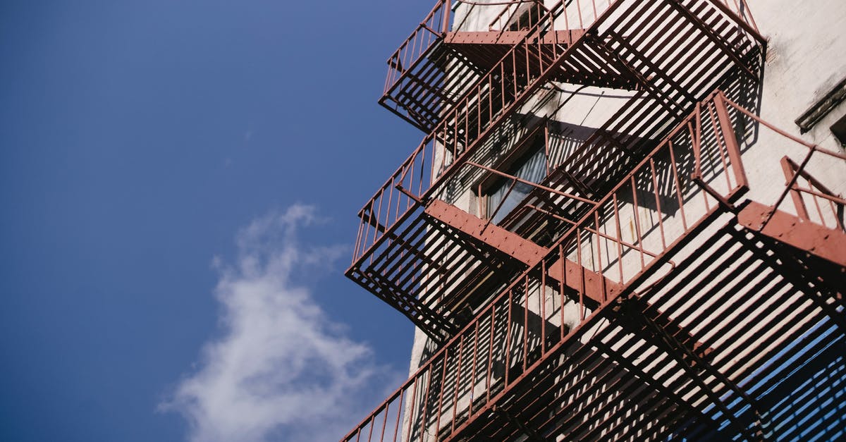 Stone or iron mortar? - Tall staircase with railings of concrete building