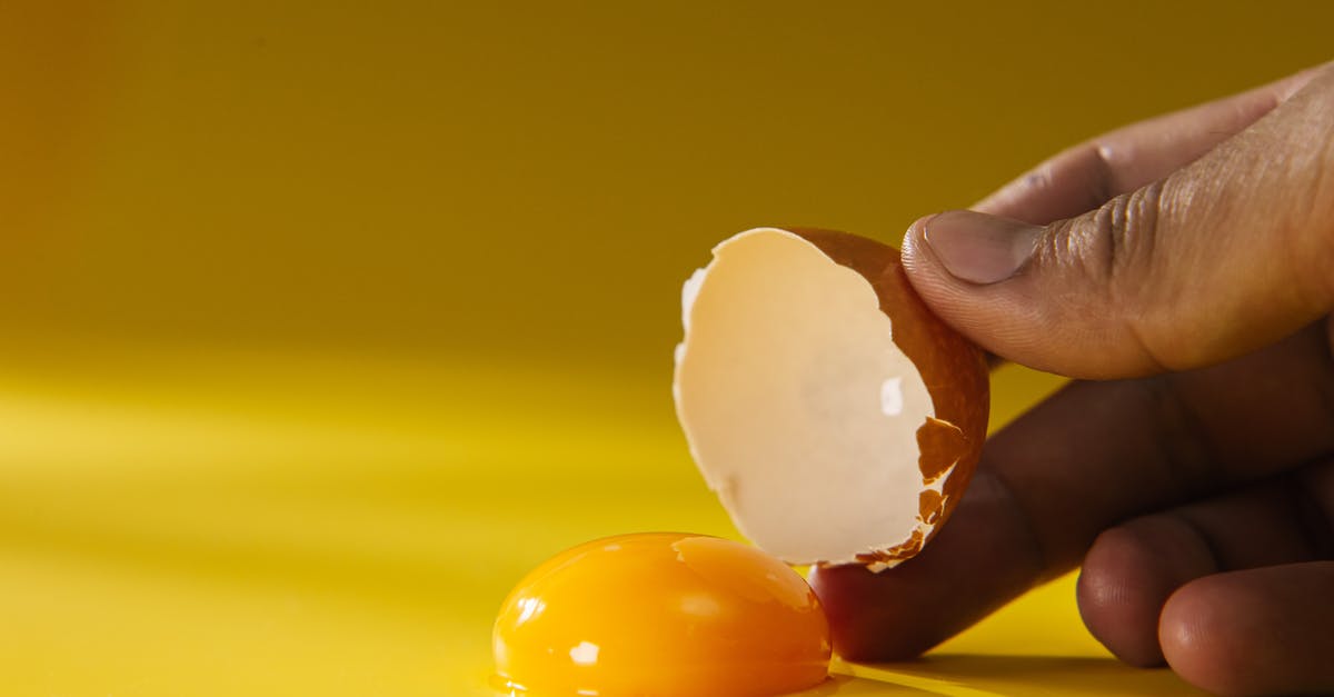 Store cracked eggs for a week? - Person Holding White Heart Shaped Ornament