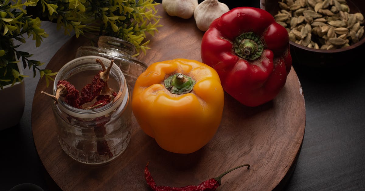 Storing dried peppers - Photograph of Bell Peppers Near Chili Peppers