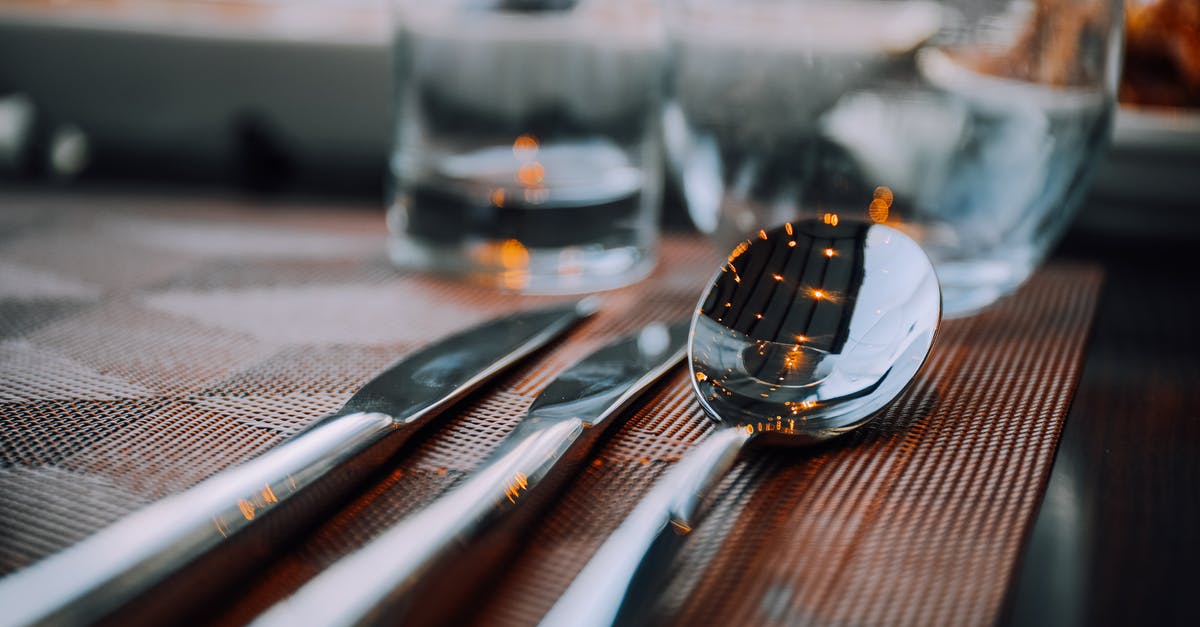 Storing knives in knife sheaths - Close-Up Photo of Silverware