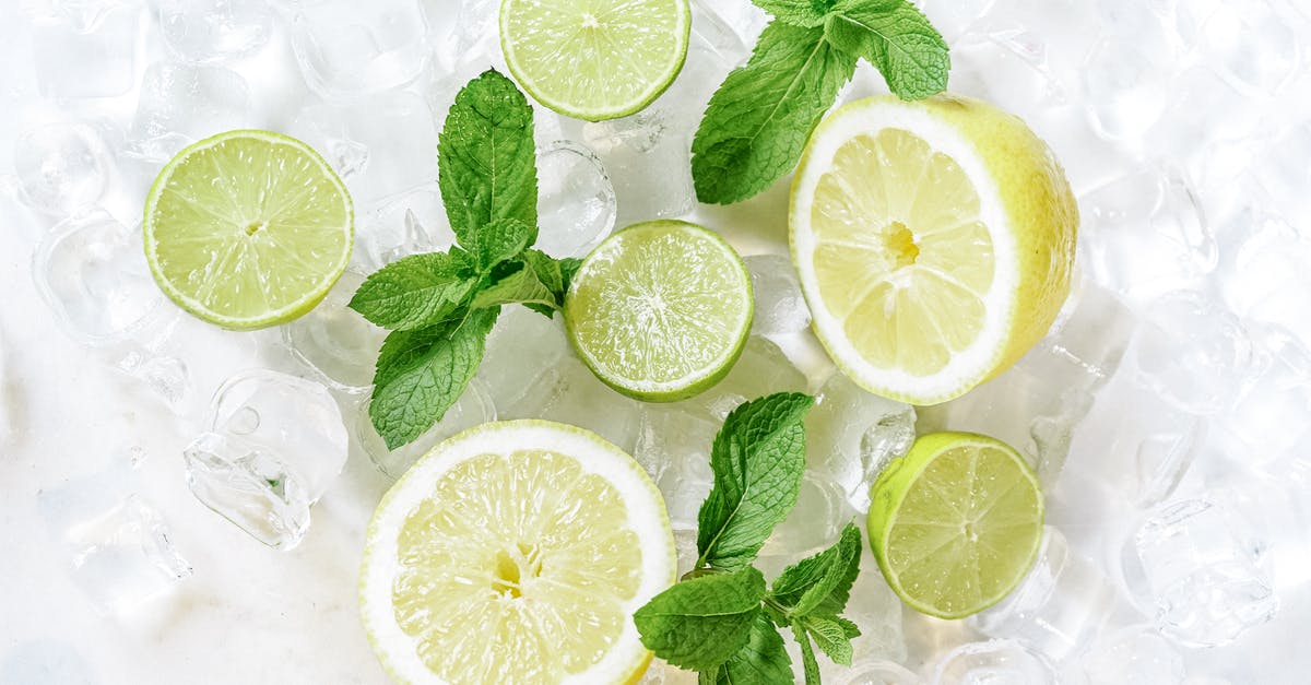 Storing lemon juice with crushed mint - Iced Sliced Lemon on Clear Drinking Glass