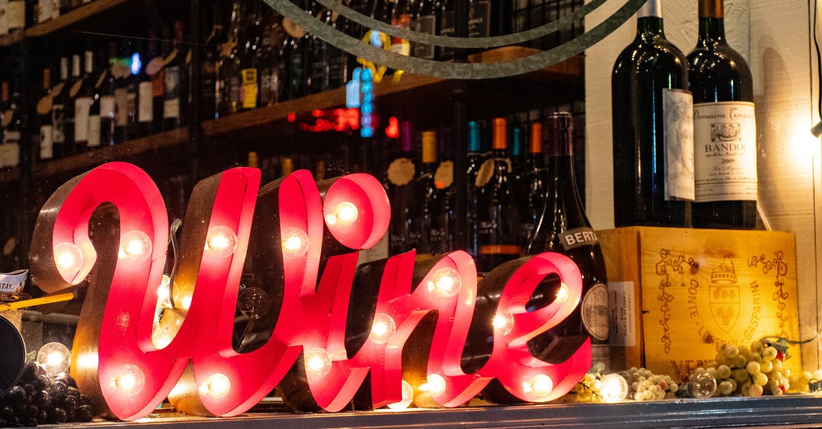 Storing sourdough starters with wine in a wine fridge? - Red Wine Marquee Signage on Table