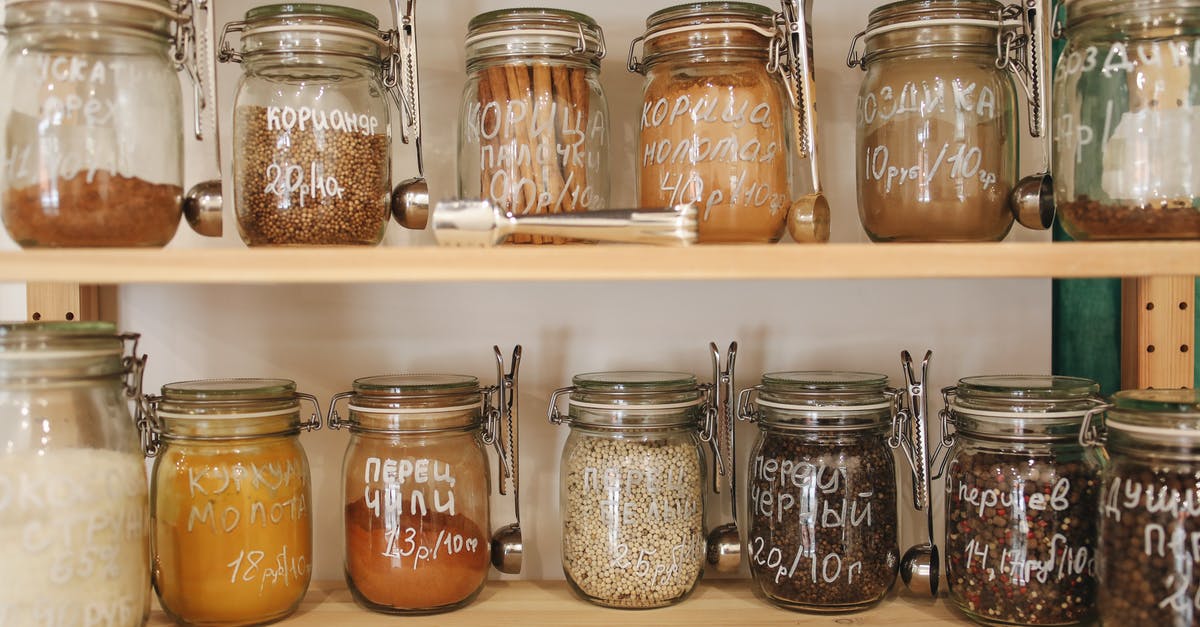 Storing spices against mold - Glass Jars on Wooden Shelf