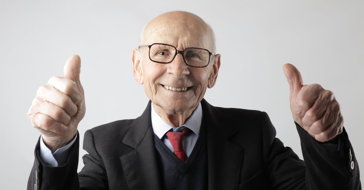 Stronger bread, how could I achieve that? - Positive senior man in eyeglasses showing thumbs up and looking at camera