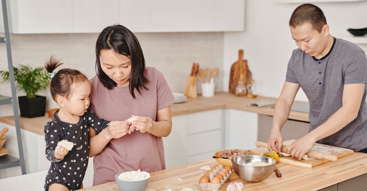 Stuffed Dumpling Made with Rice Flour - Woman Holding Dumpling with her Daughter