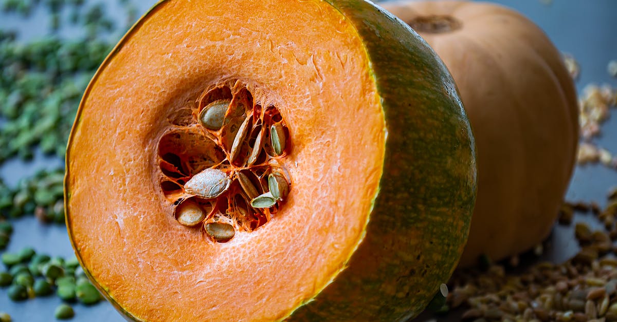 Stuffed pumpkin on a burner - Brown and Black Spider on Yellow and Green Fruit