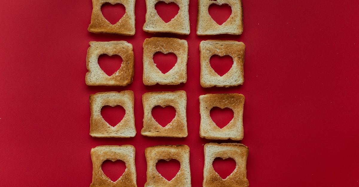 Stuffing bread for the next day - Creative slices of toasted bread placed on red background