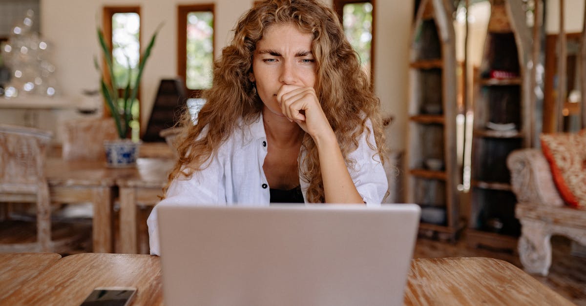 Substitute for a Standing Mixer using a paddle - Photo of Woman Looking Serious While Using Laptop