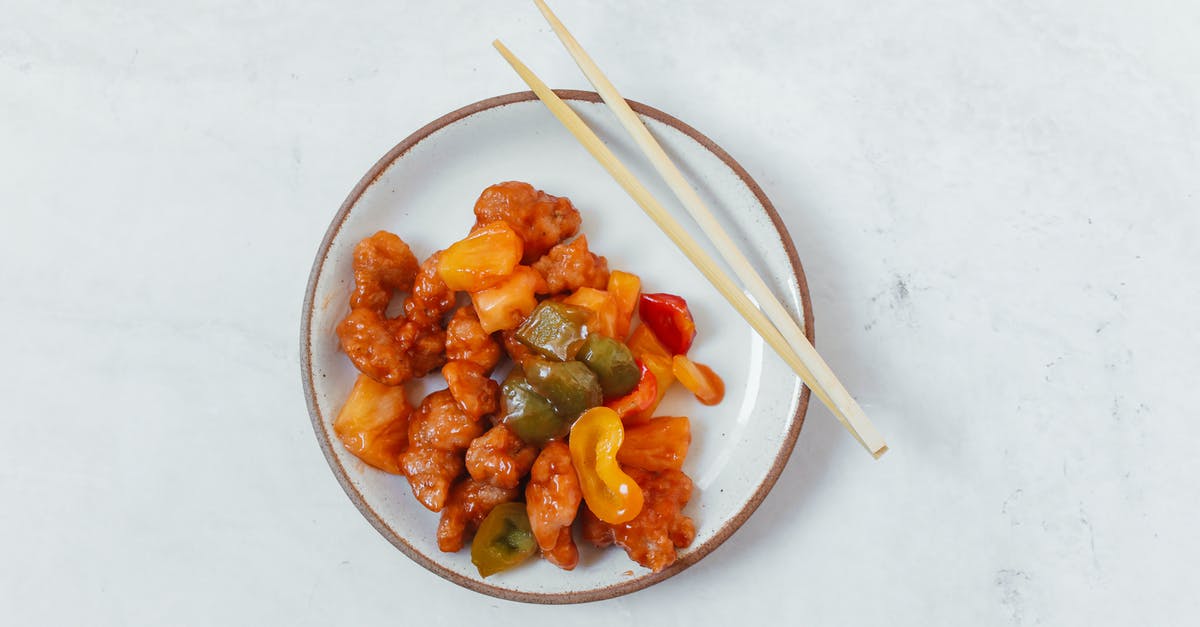 Substitute for bell peppers in meat dishes - Sweet and Sour Pork with Wooden Chopsticks on White Ceramic Bowl