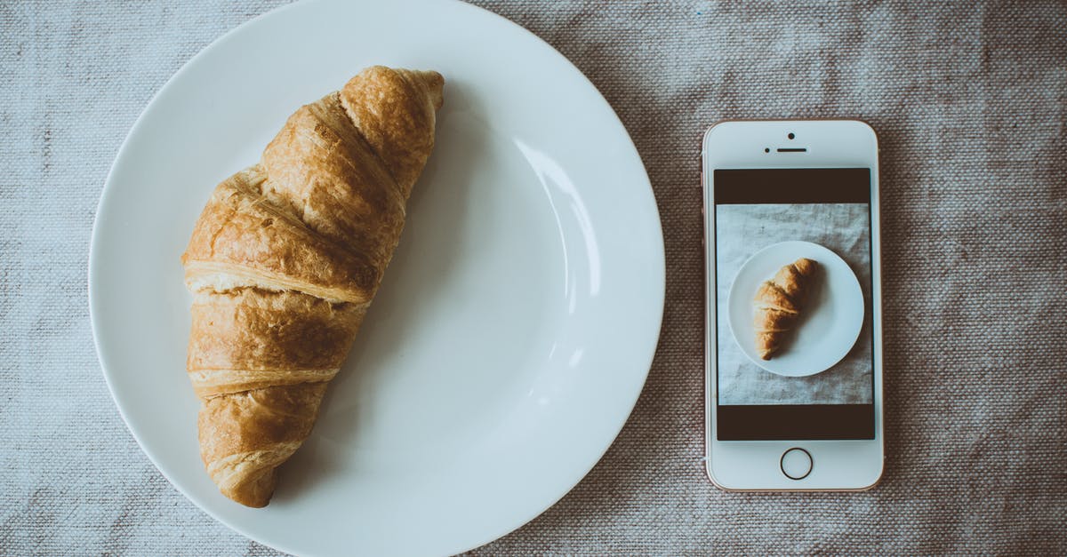 Substituting butter for oil: Does it matter for baked goods? - Croissant Bread on Round White Plate Beside Rose Gold Iphone Se Displaying Photo of Croissant Bread on Plate