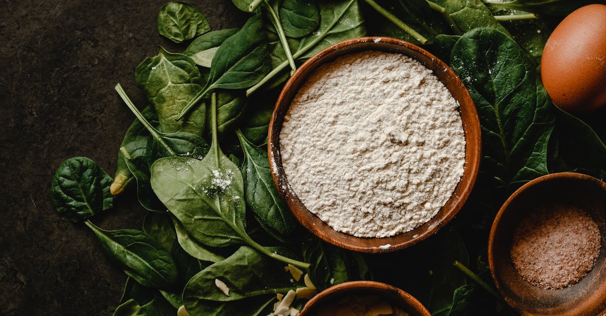 Substituting hazelnuts for almonds, baking - White Flour in the Wooden Bowl on the Green Leaves