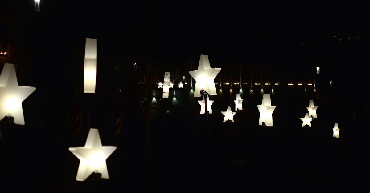 Substitution for idealmjöl - Creative star shaped garlands with glowing lamps decorating street against dark night sky