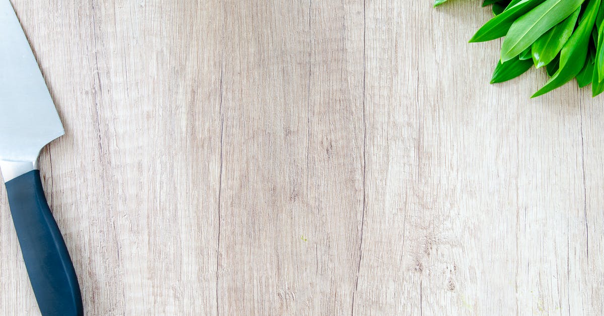 Surface tension in food - Kitchen Knife on Table