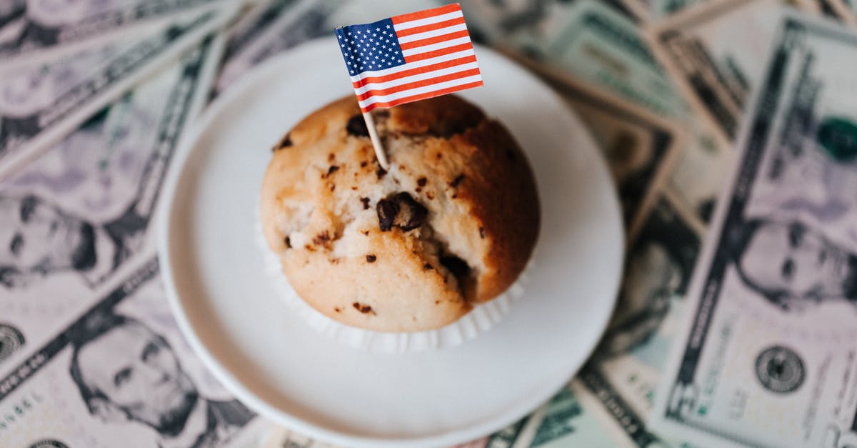 Swap for Cake Margarine in the U.S.? - Tasty cake with flag on bunch of paper dollars