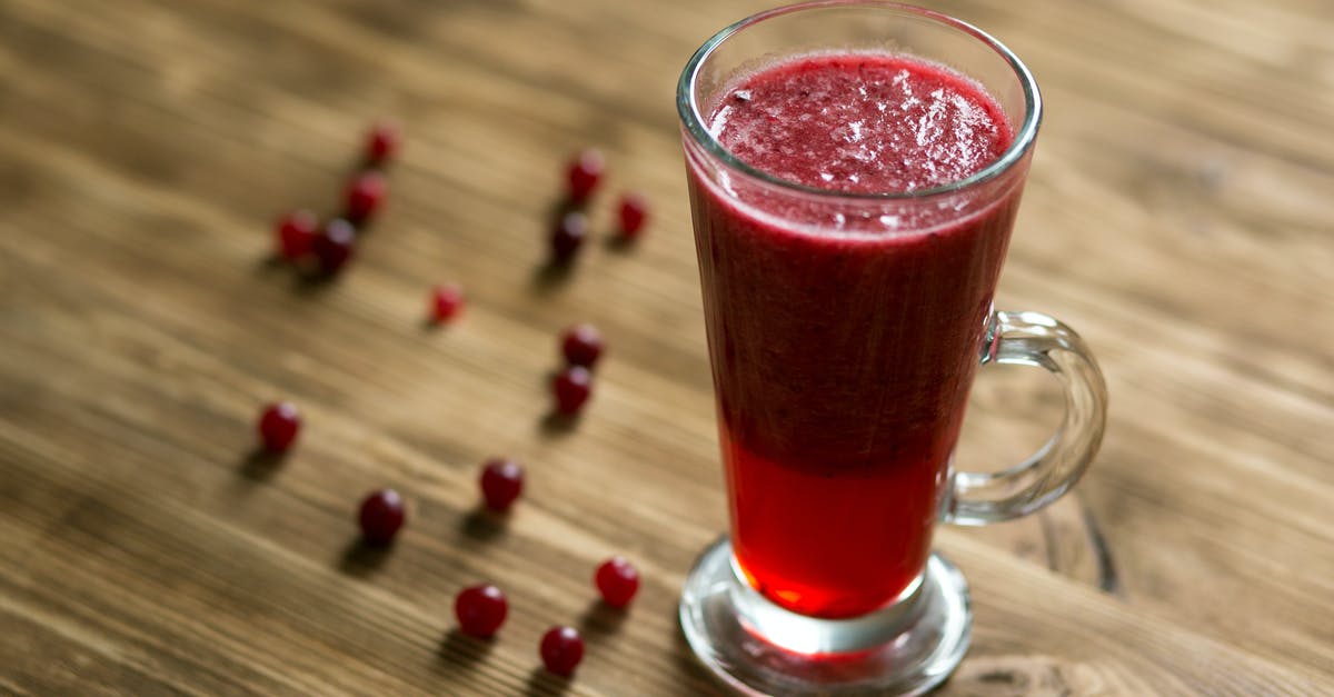 Sweetening cranberry juice impossible? - Glass Mug With Red Juice on Wooden Table