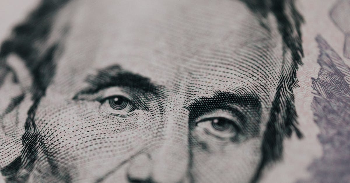 tarry deposit in wok - Closeup of male American president printed on five dollar bill and looking away pensively