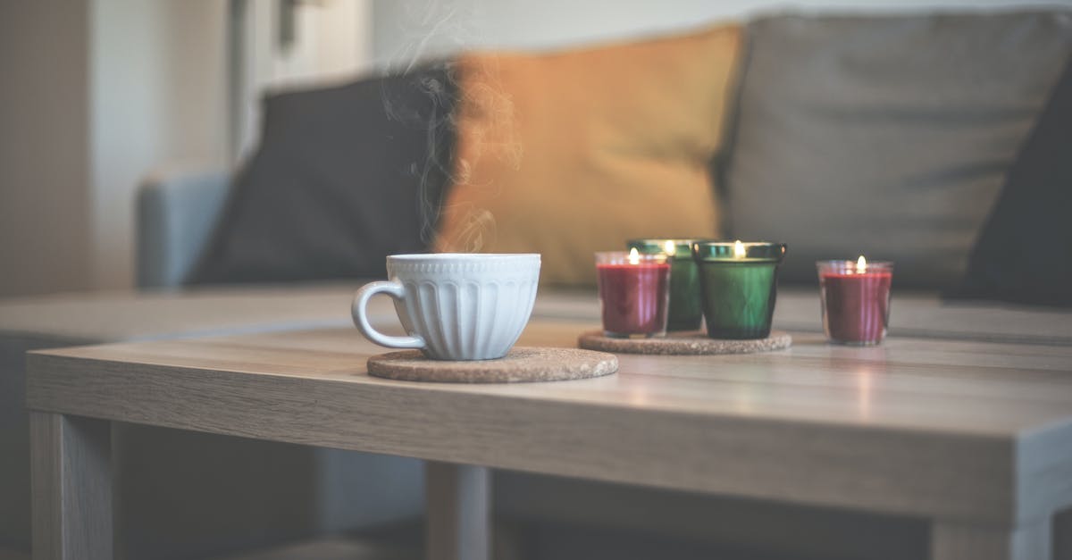 Tea cup residue - White Ceramic Teacup on Brown Wooden Table