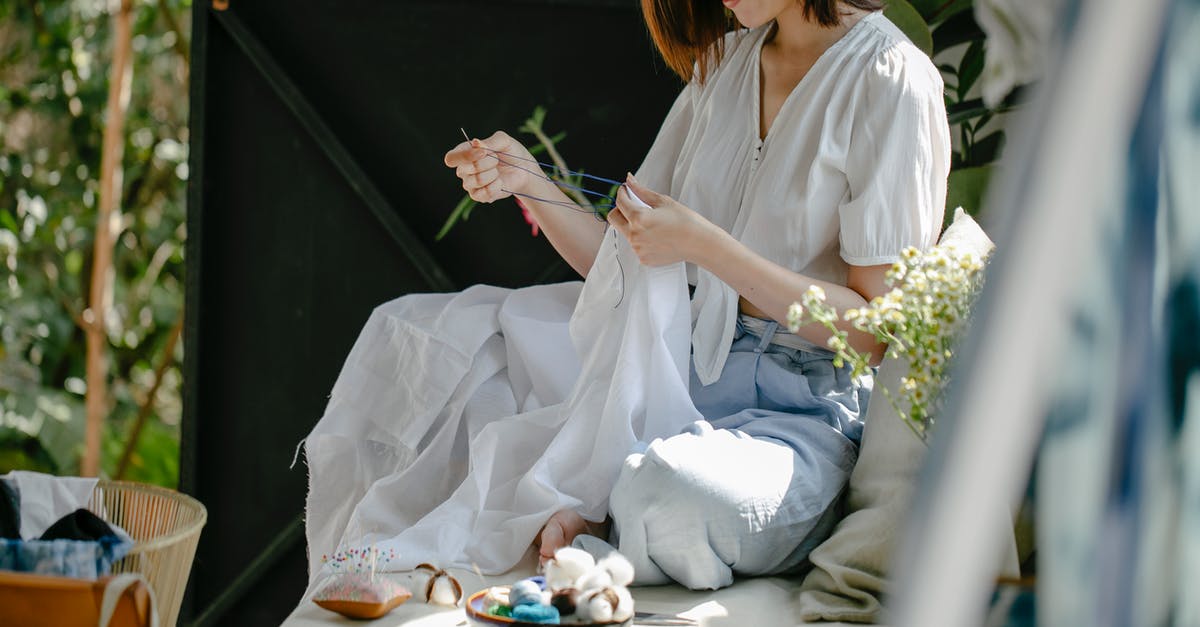 Technique to find and eliminate the needle bone in lamb shanks? - Crop ethnic craftswoman stitching textile with needle and thread while demonstrating traditional Japanese tie dye technique in sunshine