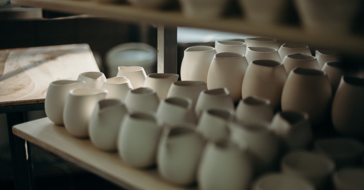 Teflon vs. Porcelain lined cookware (stove top) - Photo Of Pots On Shelves